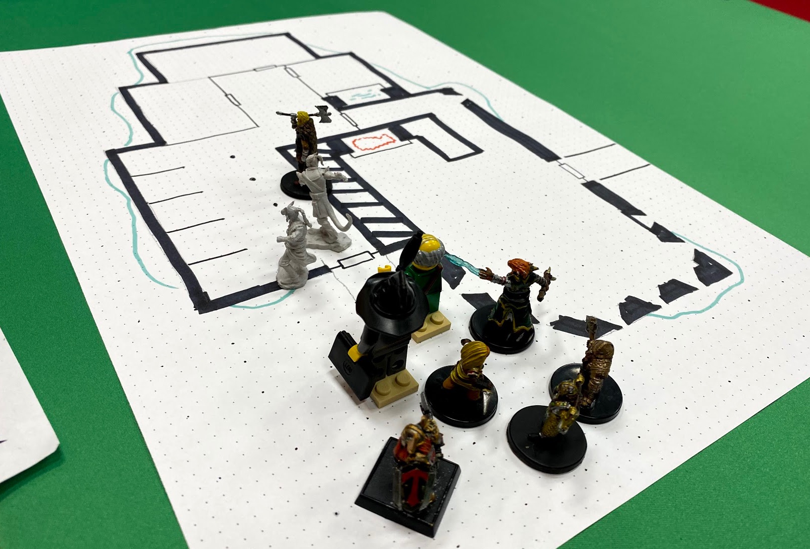 Player minis entering a dungeon
