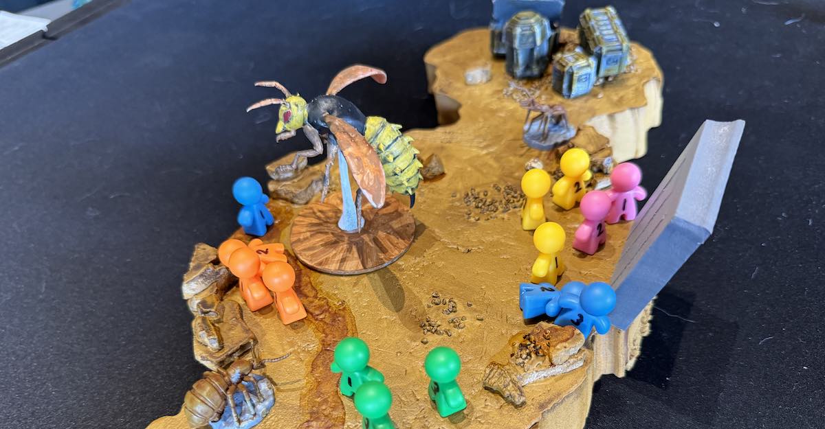 miniatures fighting a giant bee